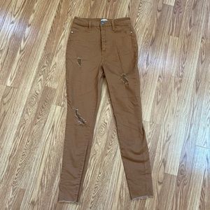 Distressed camel skinny jeans